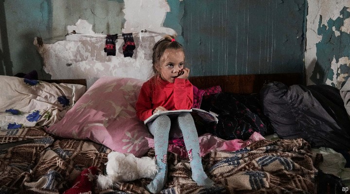 Child in rubble in Ukraine