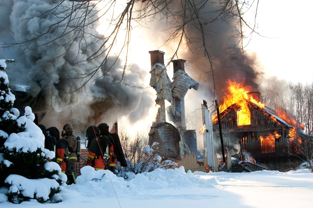 A controlled burn of houses in rural Sweden