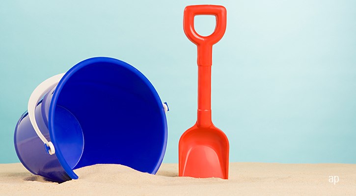 Bucket and spade on a beach