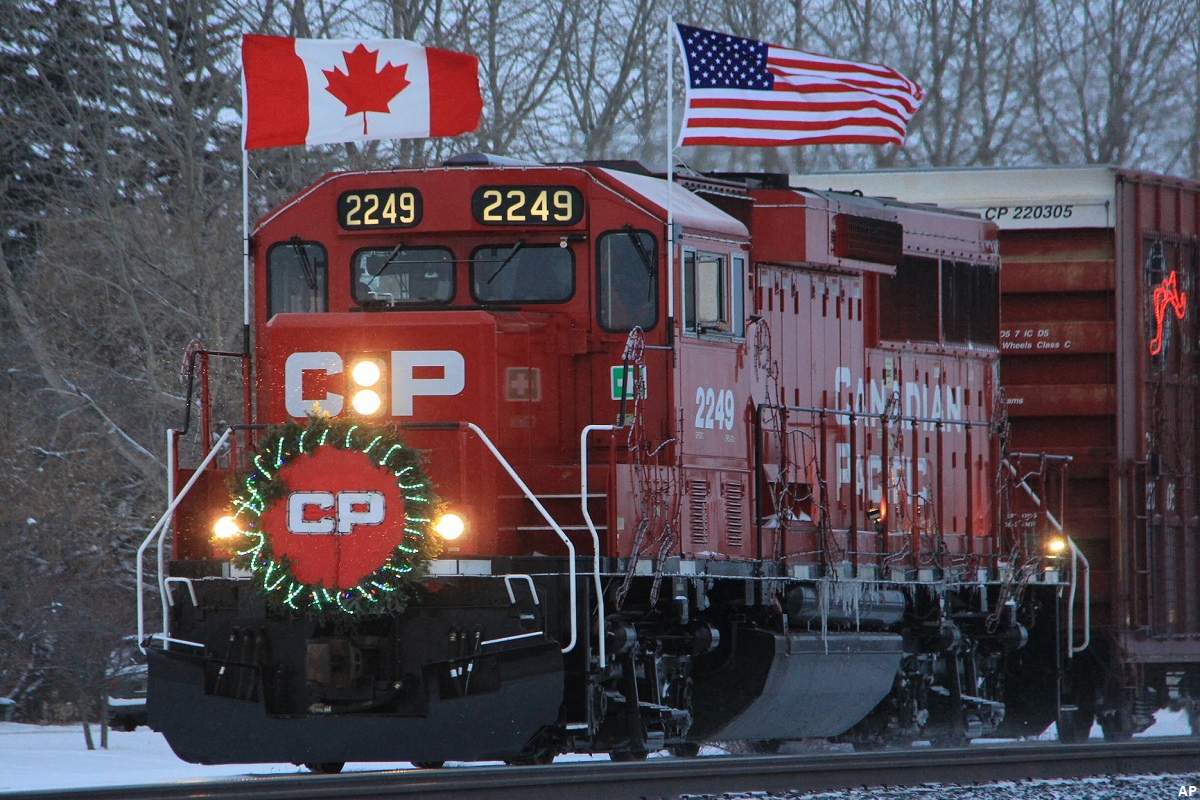 CP Rail locomotive with Canadian and American flags on top