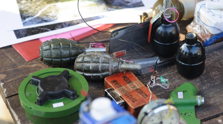 Grenades and mines bedeck a Ukrainian table during military training