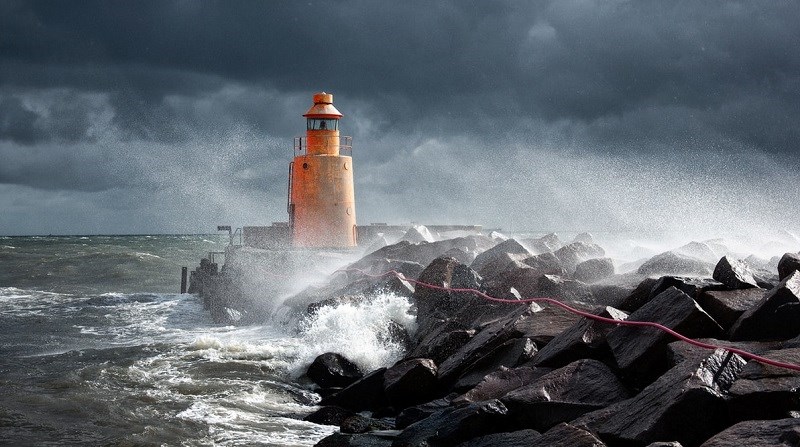 Lighthouse and ocean in a storm