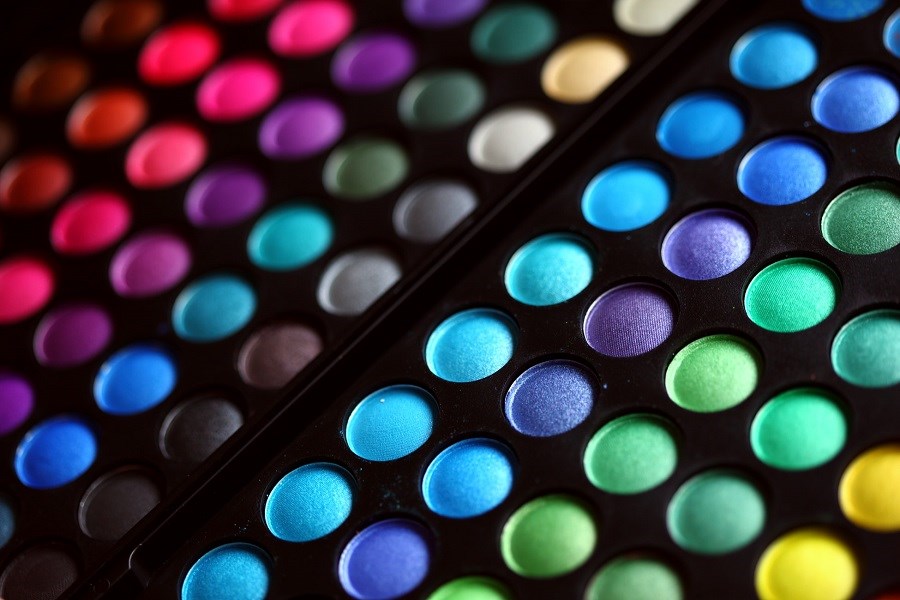 Multicoloured dots on black background