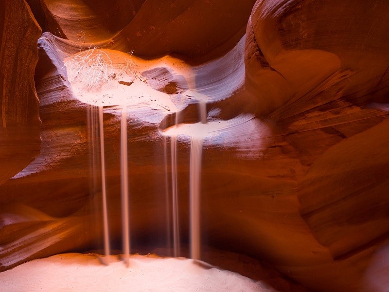 Sand falling slowly in cave
