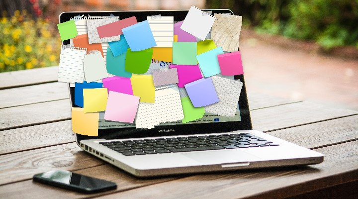 Laptop with post-it notes on