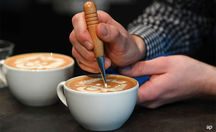 Hand making latte art