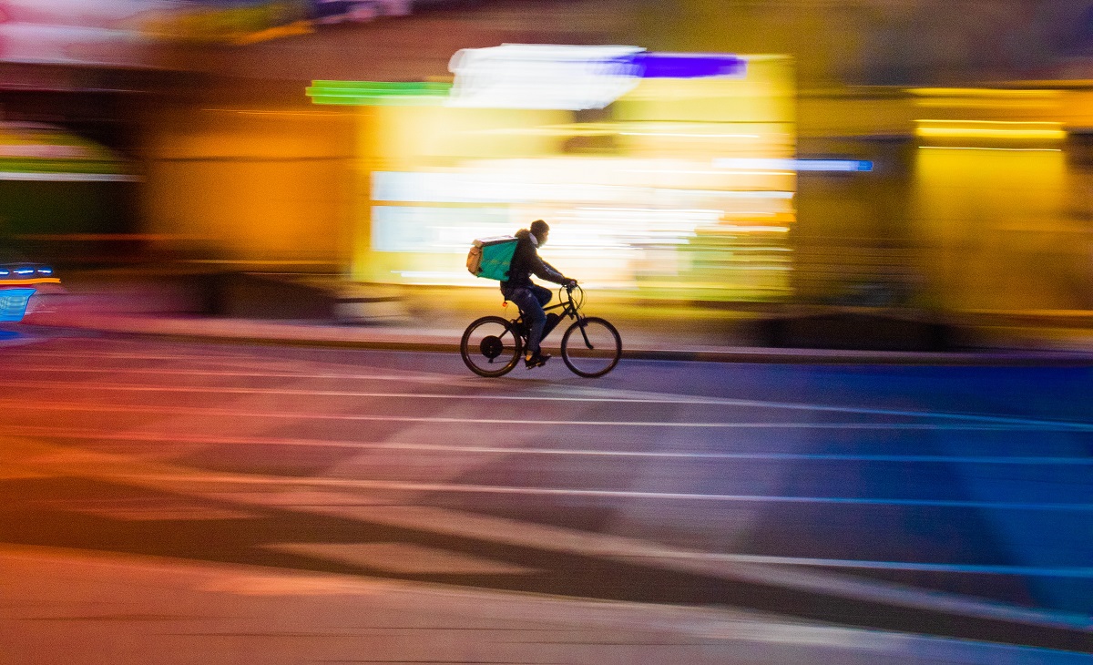 Food delivery person on bicycle