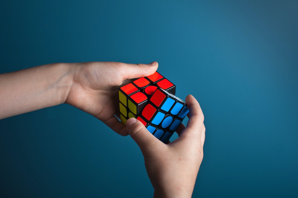 Person solving rubik&#39;s cube